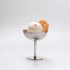 Sakura gelato in a silver coupe, salted blossom on top, monaka alongside